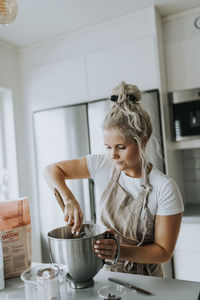 Woman baking in kitchen