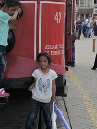 Full length of children standing in bus