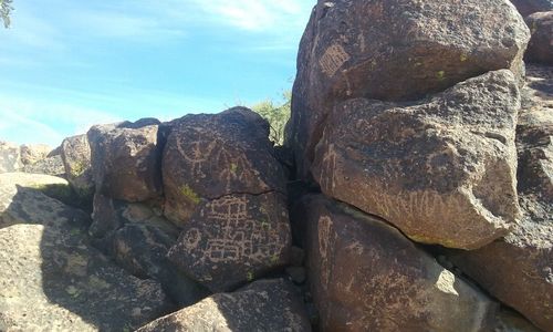 Close-up of rock against sky