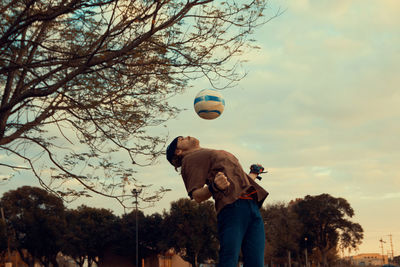 Man jumping playing soccer