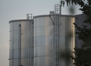 Low angle view of factory against sky