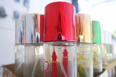 Close-up of red wine bottles on table