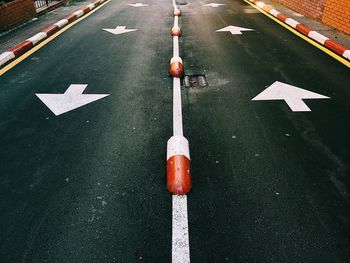 High angle view of arrow sign on road