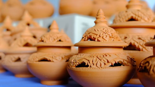 Close-up of various pots at market stall