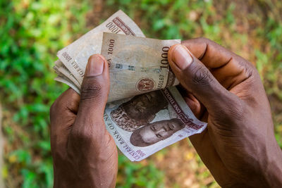 Close-up of hand holding paper
