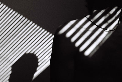 Close-up of shadow on tiled floor