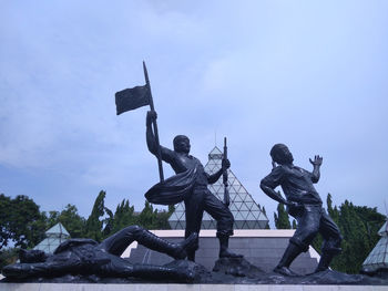 Low angle view of statue against sky