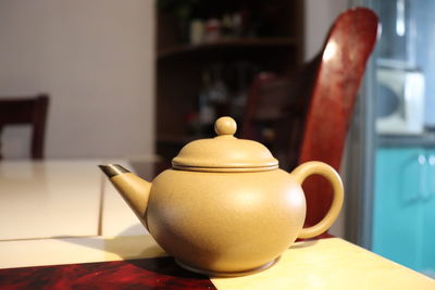 Close-up of tea cup on table at home