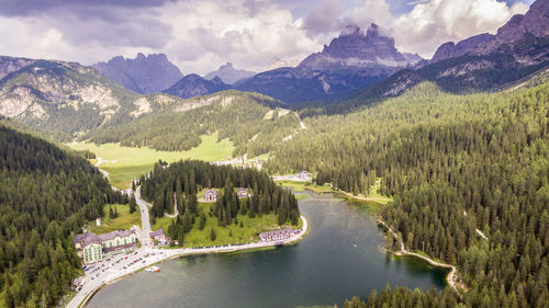 Scenic view of land and mountains against sky