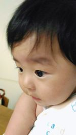 Close-up portrait of cute baby at home