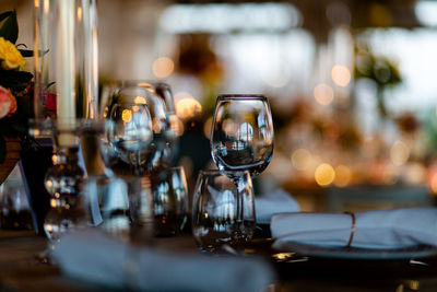 Luxury table settings for fine dining with and glassware, pouring wine to glass.