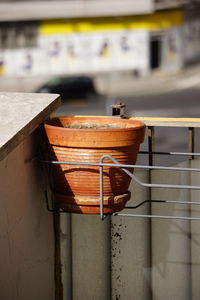 Close-up of metal railing against wall