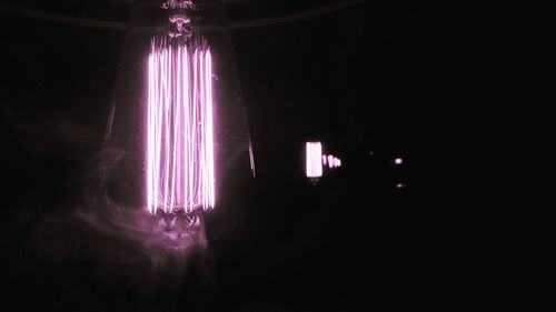 Illuminated lights in darkroom at night