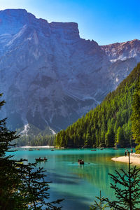 Scenic view of lake and mountains against sky