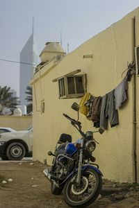 Motor scooter parked in front of building