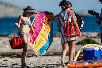 Woman with umbrella on beach