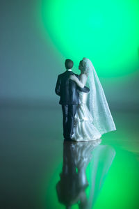 Close-up of figurine against blue background