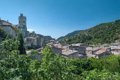 Panoramic view of buildings in city against clear sky