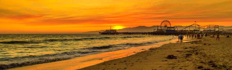 Scenic view of beach against sky during sunset