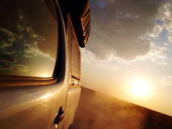 Off-road vehicle at etosha national park during sunset