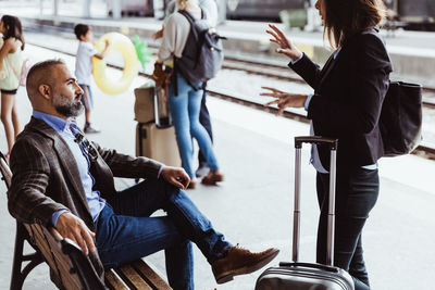 People sitting on seat in train