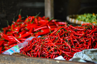 Close-up of red chili peppers for sale at market stall