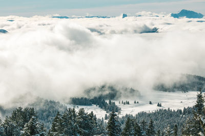 Scenic view of snow covered mountains against sky