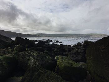 Scenic view of sea against cloudy sky