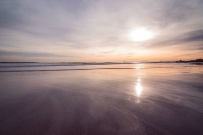 Scenic view of sea against sky at sunset