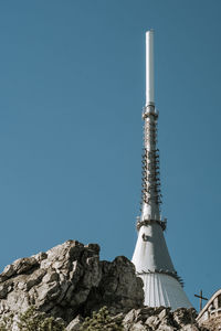 Low angle view of tower against clear blue sky