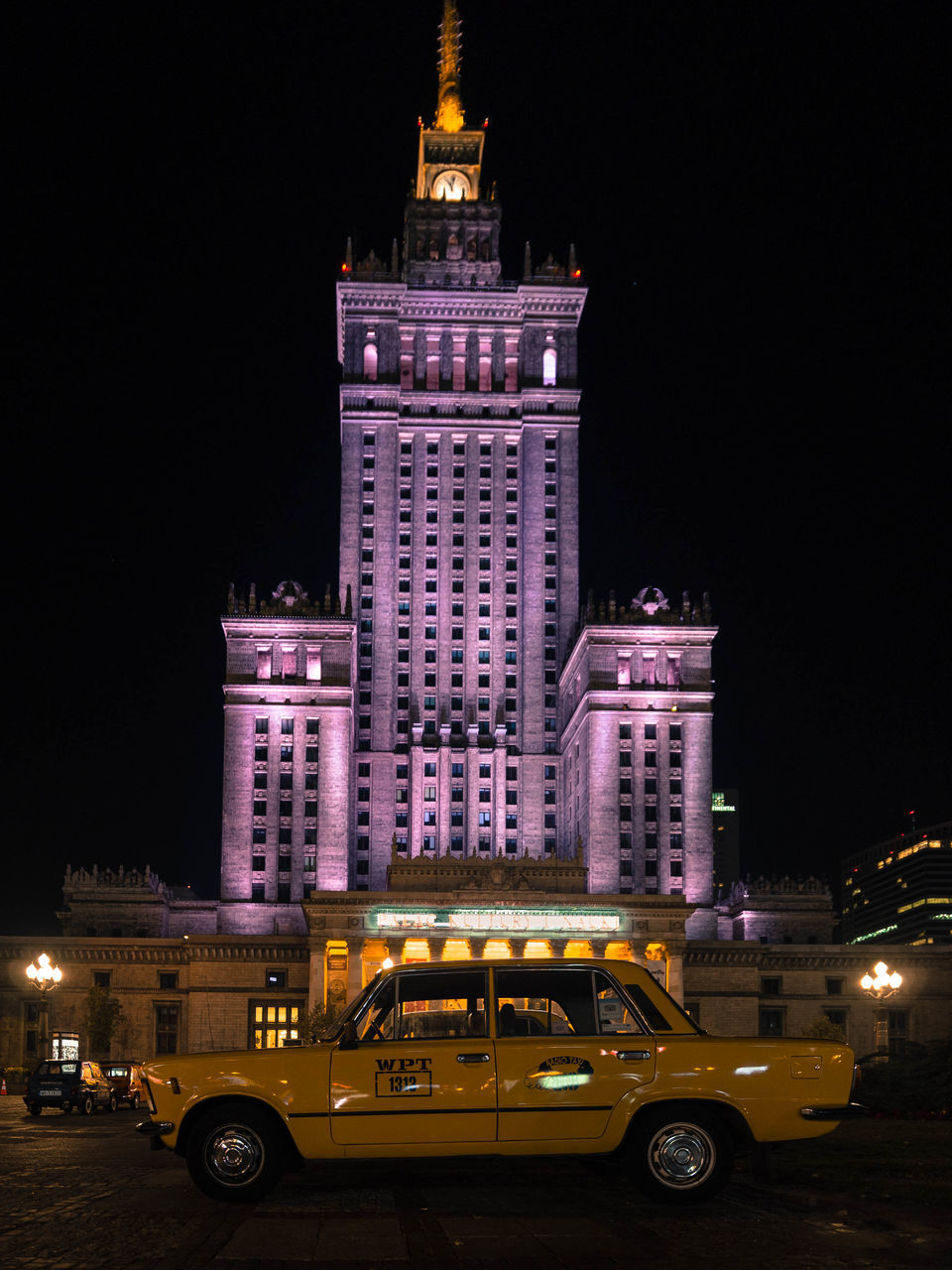 VIEW OF ILLUMINATED BUILDINGS AT NIGHT