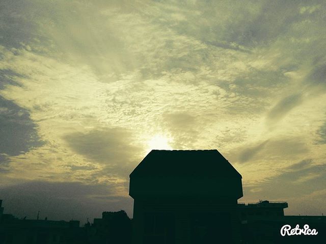 building exterior, architecture, sky, built structure, cloud - sky, sunset, cloudy, low angle view, cloud, silhouette, outdoors, city, nature, weather, beauty in nature, scenics, no people, building, dusk, house