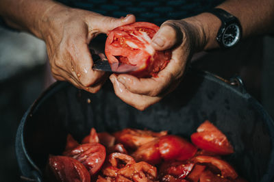 Cropped hand of person preparing food