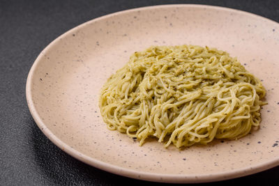 Close-up of noodles in plate on table