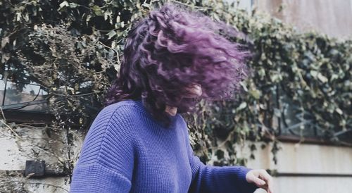 Portrait of man standing on purple outdoors