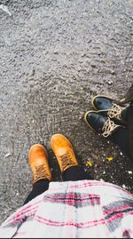 Low section of person standing on footpath