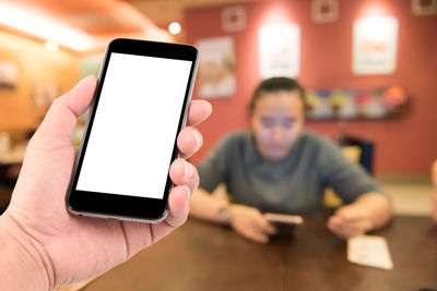 Low angle view of person using mobile phone