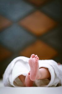 Low section of baby feet