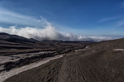 Scenic view of volcanic landscape against sky