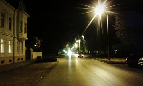 View of illuminated street at night