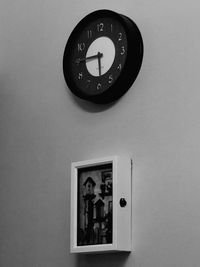 Close-up of clock on wall