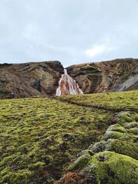 Rock formations on landscape against sky