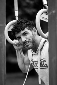 Portrait of young man holding camera