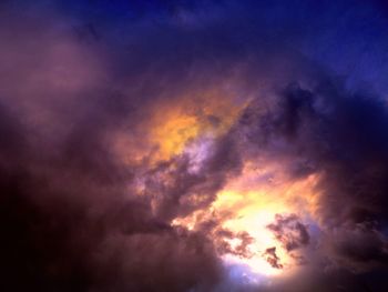 Low angle view of dramatic sky at sunset