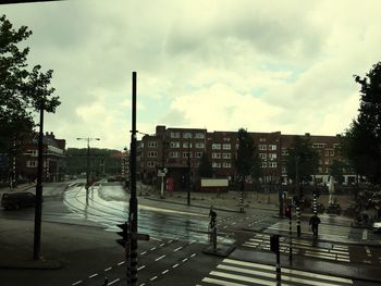 City street against cloudy sky