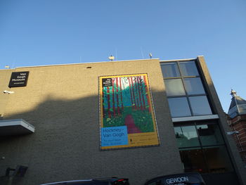 Low angle view of building against clear blue sky