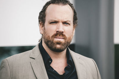 Portrait of businessman standing outdoors