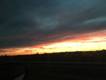 Scenic view of silhouette landscape against romantic sky at sunset