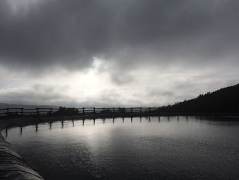 View of calm sea against cloudy sky