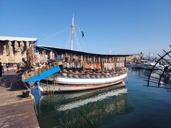Boats moored at harbor